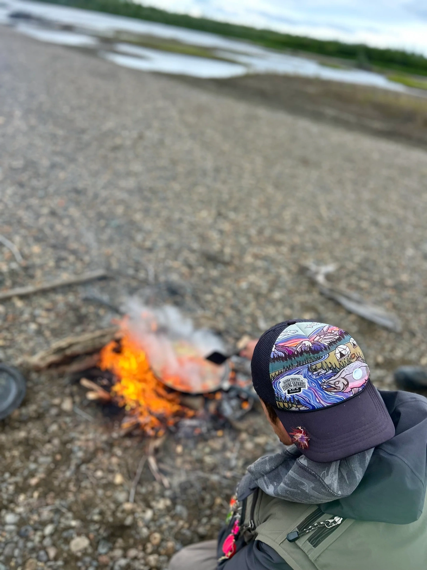 Shore lunch campfire on the river bank